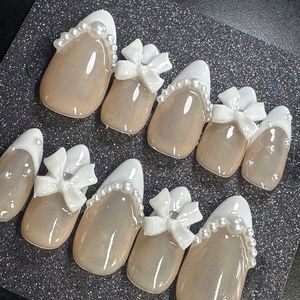 Medium almond French tip with pearls and ribbons custom handmade press-on nails